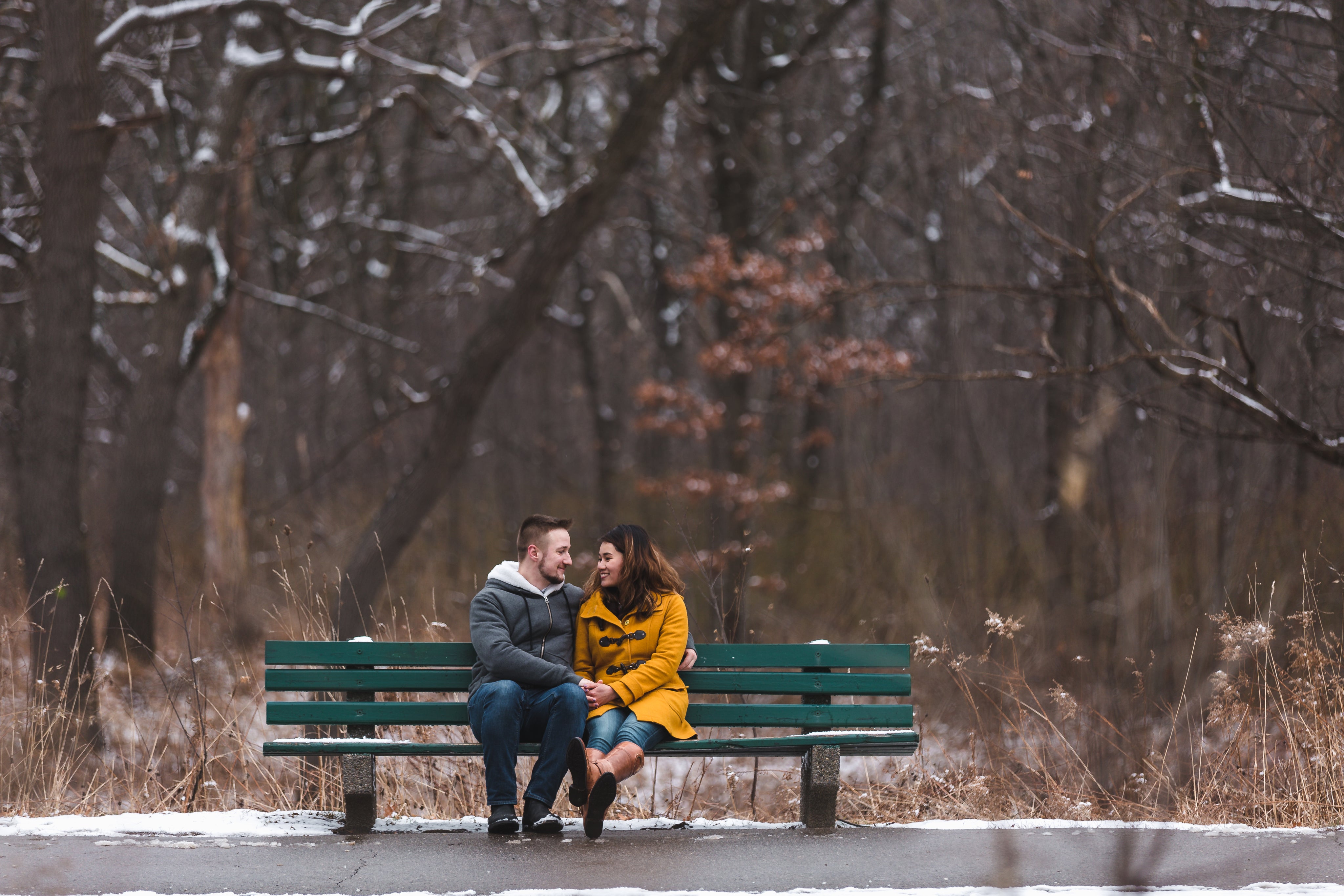 files/man-and-woman-hold-hands-on-a-bench-in-a-snowy-park.jpg